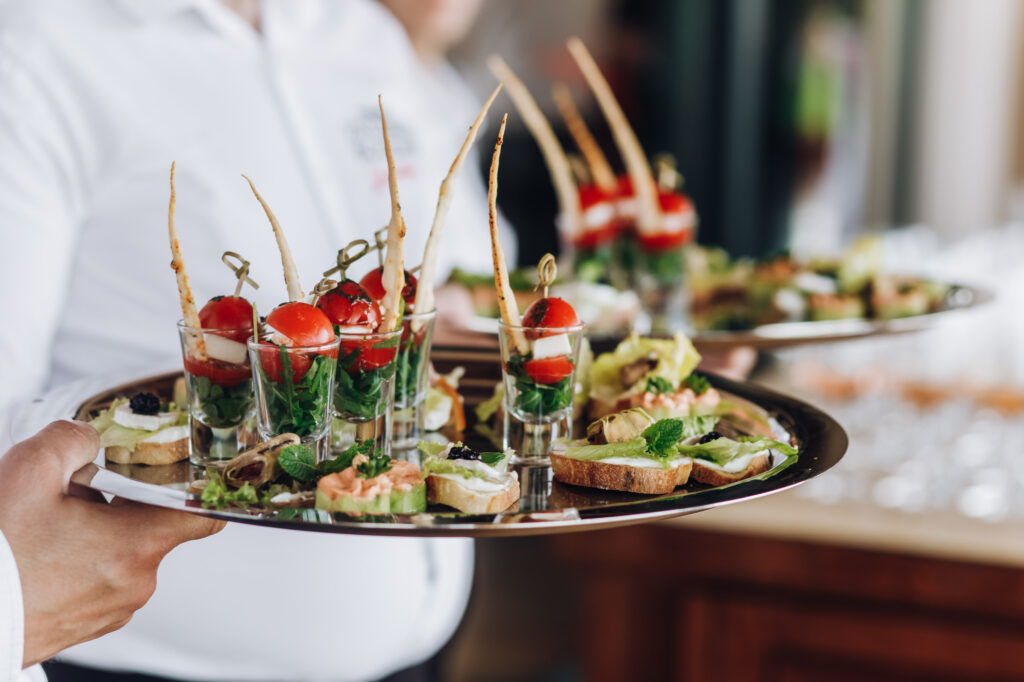 waiter-keeps-salver-with-snacks